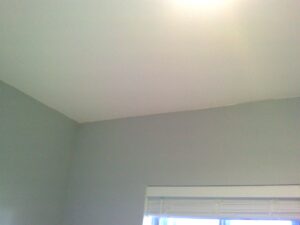 Interior drywall bowing at ceiling and wall seam